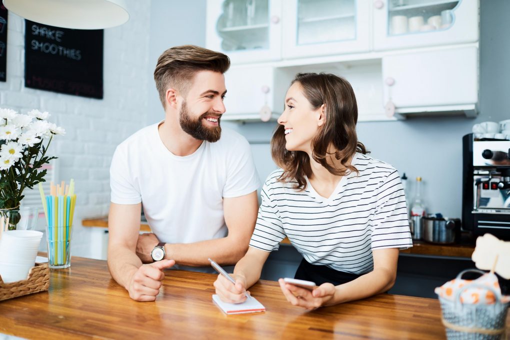 couple looking at each other in a kitchen