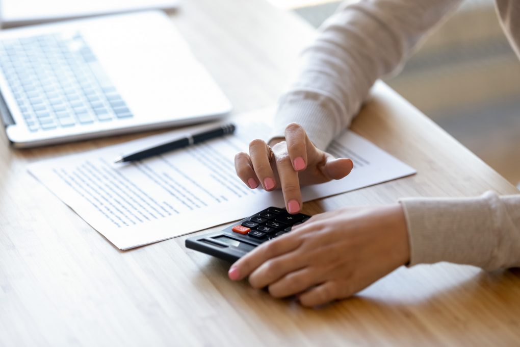 a woman using a calculator